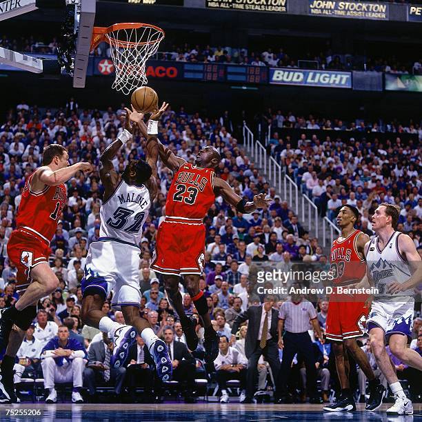 Karl Malone of the Utah Jazz attempts a layup against Michael Jordan of the Chicago Bulls in Game Six of the 1998 NBA Finals at the Delta Center on...