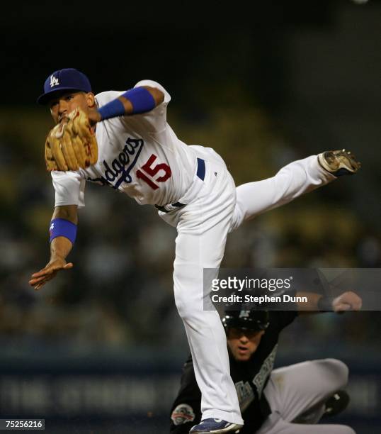 Shortstop Rafael Furcal of the Los Angeles Dodgers watches his throw as he completes a double play after forcing out Jeremy Hermida of the Florida...