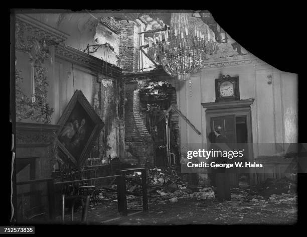 Damage in the Court Room at the Stationers' Hall after an air raid on the City of London, 31st October 1940. On the left is a painting of former Lord...