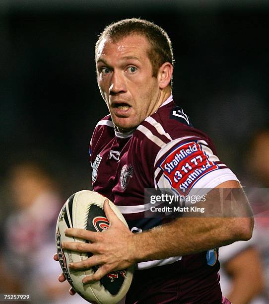 Michael Monaghan of the Sea Eagles makes a break during the round 17 NRL match between the Manly Warringah Sea Eagles and the Sydney Roosters at...
