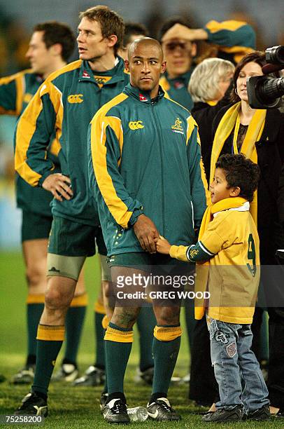 Australia's George Gregan and Stephen Larkham listen to speeches after their team won in the Tri-Nations rugby union Test against South Africa in...