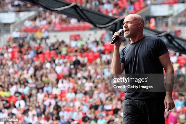 Genesis frontman Phil Collins performs on stage during the Live Earth concert at Wembley Stadium on July 7, 2007 in London, England. Live Earth is a...