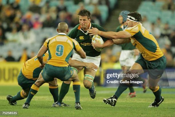 George Gregan and Guy Shepherdson of the Wallabies tackle Bob Skinstad during of the Springboks during the 2007 Tri Nations match between Australian...