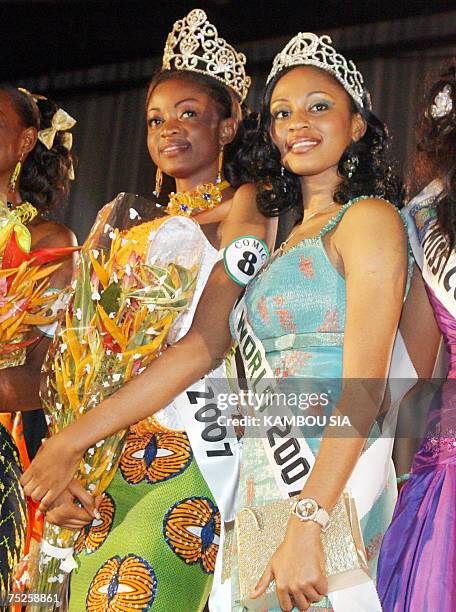 Year-old Bernadette N'Zi poses together with Miss Nigeria, after being elected Miss Ivory Coast 2007 during the 11th edition of the contest 06 July...