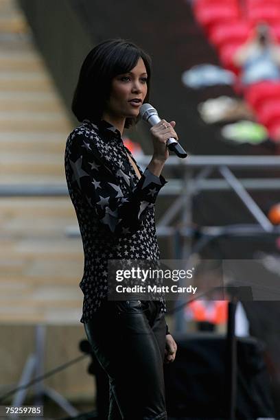 American actress Thandie Newton presents Paolo Nutini on stage during the Live Earth concert held at Wembley Stadium on July 7, 2007 in London. Live...