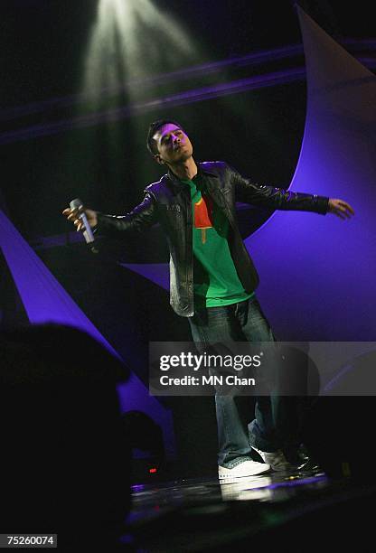 Hong Kong singer Anthony Wong performs on stage at the China leg of the Live Earth series of concerts at the Oriental Pearl Tower on July 7, 2007 in...