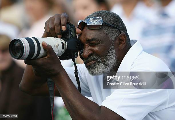 Richard Williams, father and coach of Venus Williams of USA takes a photograph following her Women's Singles final match between Marion Bartoli of...