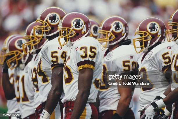 Greg Jones, Leomont Evans, Derek Smith and Patrise Alexander line up for the Washington Redskins defense during their National Football Conference...