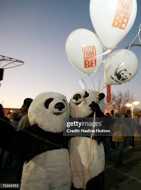 Panda mascots entertain people having fun outside the Live Earth concert at the Coca-Cola Dome on July 7, 2007 in Johannesburg, South Africa. Live...