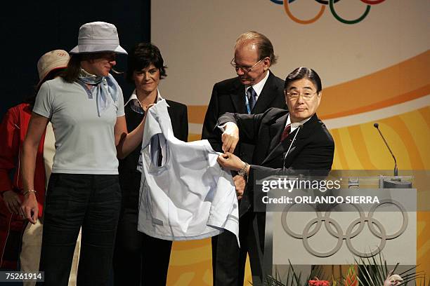 Guatemala City, GUATEMALA: Masato Mizuno , chairman of Mizuno Corporation, shows the official clothing for the 2008 Beijing Olympic Games, at the end...