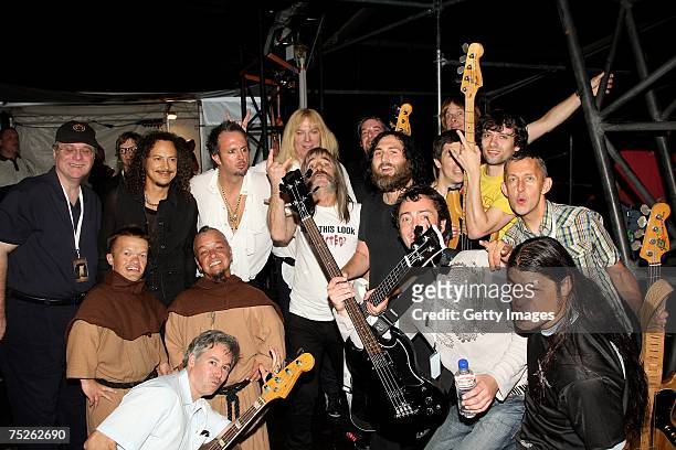 Members of Metallica including Kirk Hammett and Robert Trujillo and of spoof heavy metal band Spinal Tap pose backstage during the Live Earth concert...