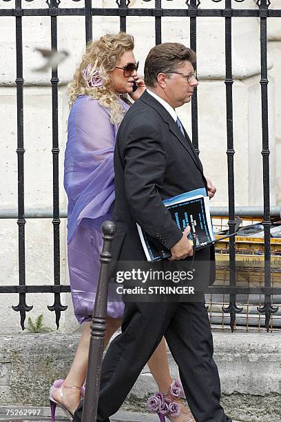 Superstar Tony Parker's mother Pamela Firestone arrives with an unidentified person at Saint-Germain l'Auxerrois church to attend the wedding...