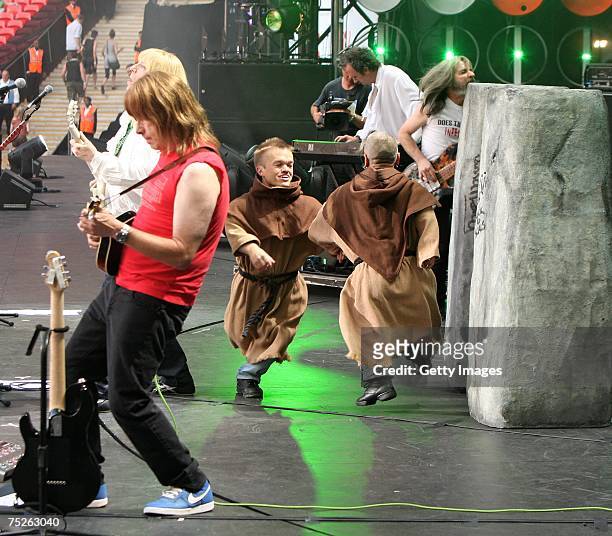 Christopher Guest and Michael McKean of spoof heavy metal band Spinal Tap perform on stage during the Live Earth concert at Wembley Stadium on July...