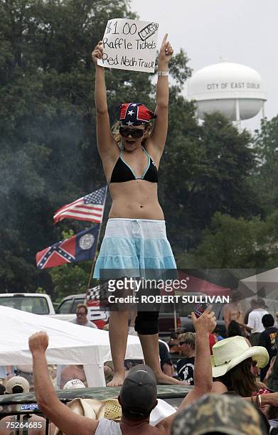 Woman sells raffles tickets for a car 07 July 2007 during the 2007 Redneck Games in East Dublin, Georgia. The day-long yearly festival celebrates the...
