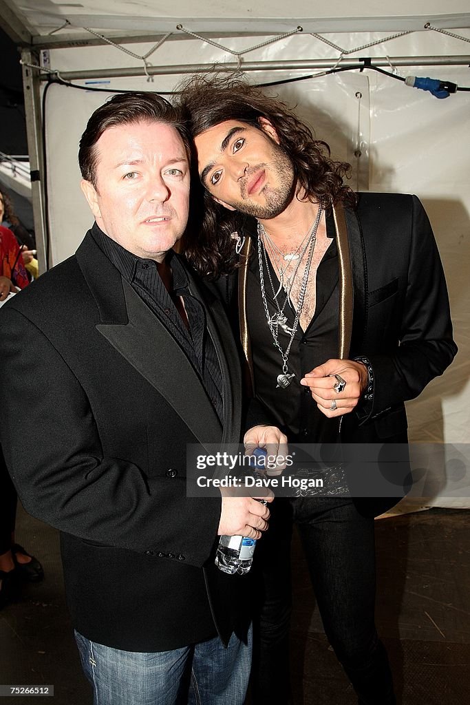 Comedians Ricky Gervais and Russell Brand pose backstage at the Live