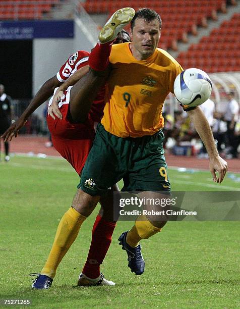 Mark Viduka of Australia is challenged by Ahmed Al Mahaijri of Oman during the AFC Asian Cup 2007 group A match between Australia and Oman at the...