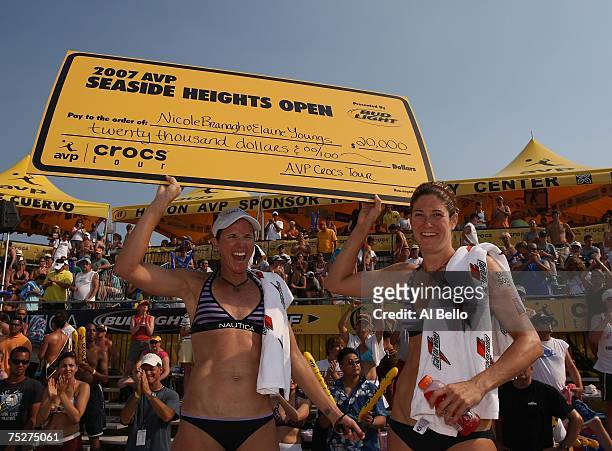 Nicole Branagh and Elaine Youngs hold the winners check after defeating Jennifer Boss and April Ross in the finals of the the AVP Seaside Heights...