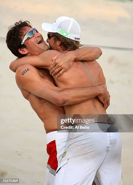 Mike Lambert and Stein Metzger celebrate matchpoint against Phil Dalhausser and Todd Rogers in the finals at the AVP Seaside Heights Open on July 8,...