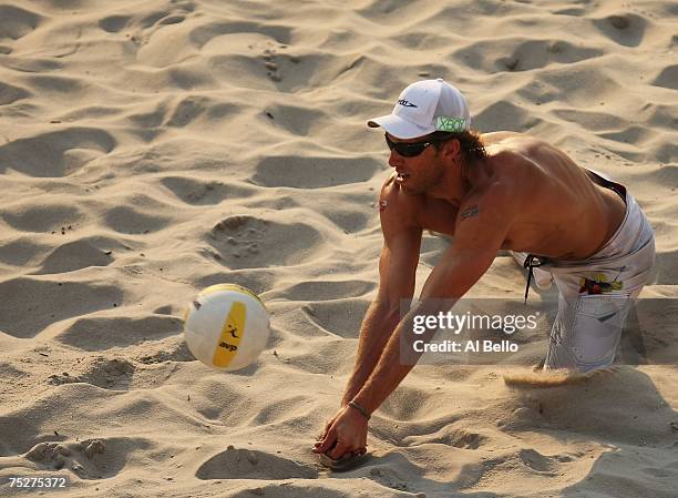 Stein Metzger dives for the ball against against Phil Dalhausser and Todd Rogers in the finals at the AVP Seaside Heights Open on July 8, 2007 at...