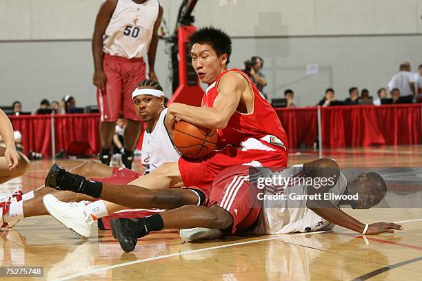 Sun Yue of the Chinese National Team fights for a loose ball against Shannon Brown and the Cleveland Cavaliers during the NBA Summer League on July...