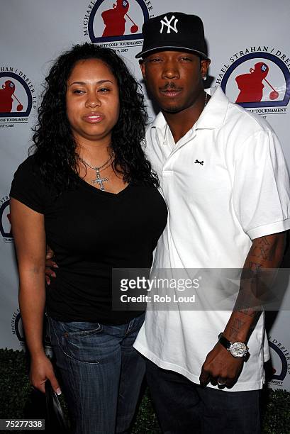 Ja Rule and Aisha Murray Atkins arrive at the Michael Strahan / Dreier LLP Charity Golf Tournament party at Tao on July 8, 2007 in New York City.