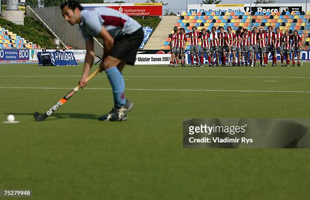 Carlos Nevado of Uhlenhorster HC prepares for the final penalty shot as team Club an der Alster looks on during the German Field Hockey Championship...