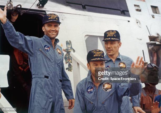 The safe return of the Apollo 13 astronauts after their lunar landing mission encountered technical difficulties, 17th April 1970. From left to...