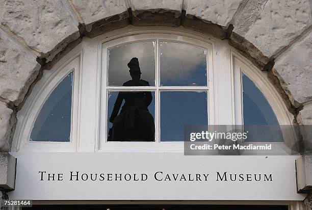 Statue is reflected in a window above the front entrance to the Household Cavalry Museum on July 9, 2007 in London. The museum has a unique...