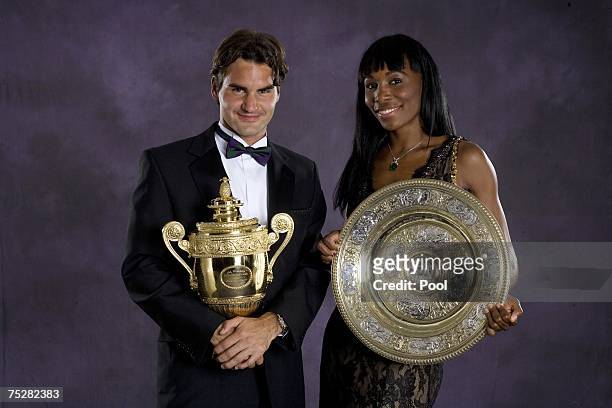 Roger Federer of Switzerland, men's singles Wimbledon champion, and Venus Williams, women's Wimbledon champion, pose together at the Champions'...