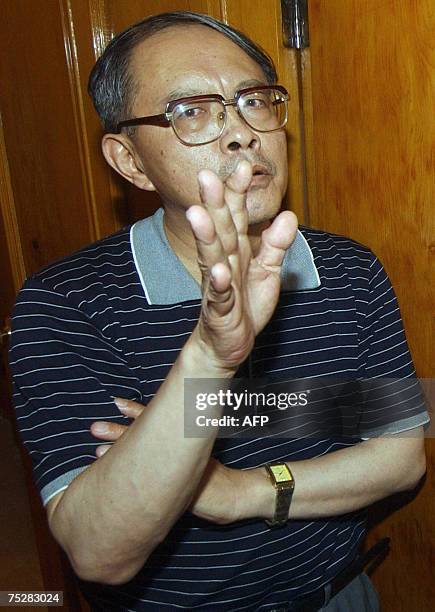 China's deputy ambassador in Pakistan, Mao Siwei gestures as he speaks with media representatives in Peshawar, 09 July 2007, after unidentified...