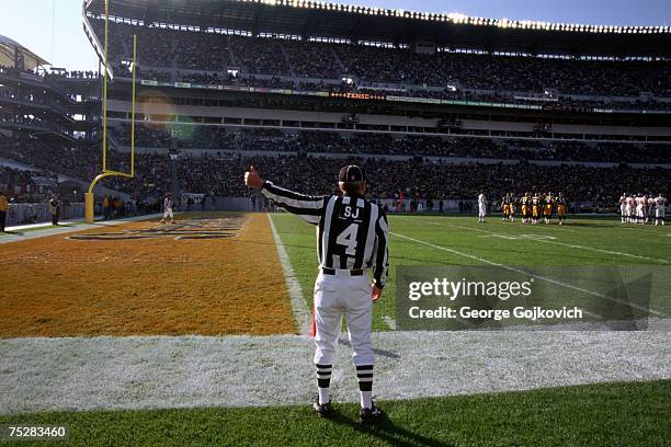 National Football League side judge Doug Toole signals during a game between the Minnesota Vikings and Pittsburgh Steelers at Heinz Field on December...