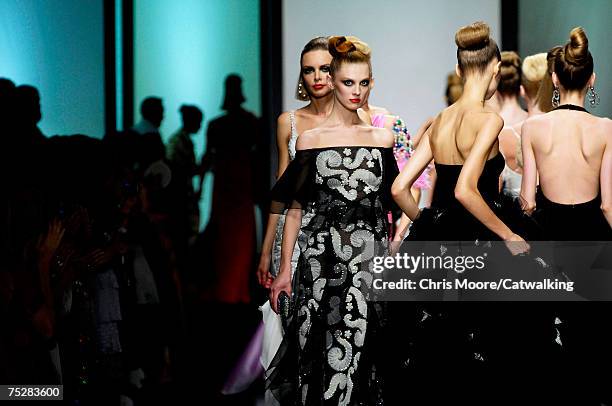 Models walk the catwalk during the Valentino 45th Anniversary Fall/Winter Haute Couture Fashion Show at the Santo Spirito in Sassia complex on July...