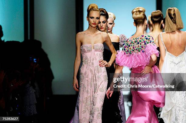 Models walk the catwalk during the Valentino 45th Anniversary Fall/Winter Haute Couture Fashion Show at the Santo Spirito in Sassia complex on July...