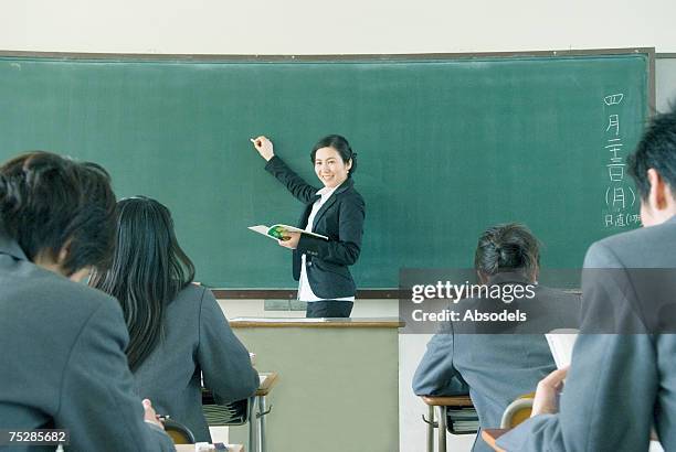 a teacher giving a lesson - japanese girls hot fotografías e imágenes de stock