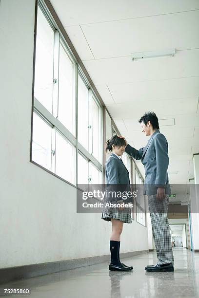 a male student patting his classmate's head - hot boy body stock pictures, royalty-free photos & images