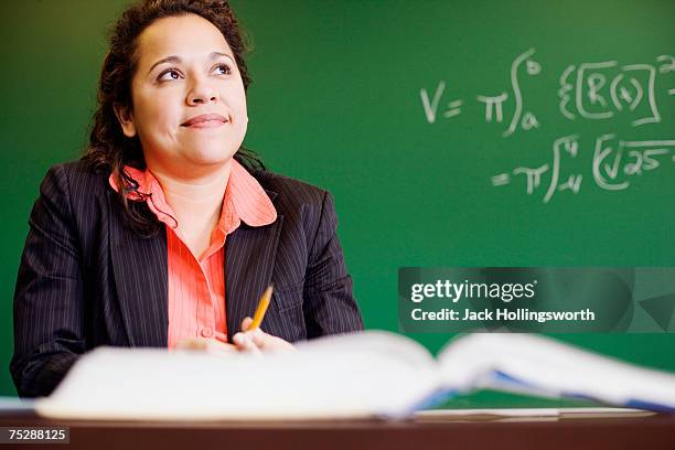 teacher thinking in classroom - teacher preparation stock pictures, royalty-free photos & images