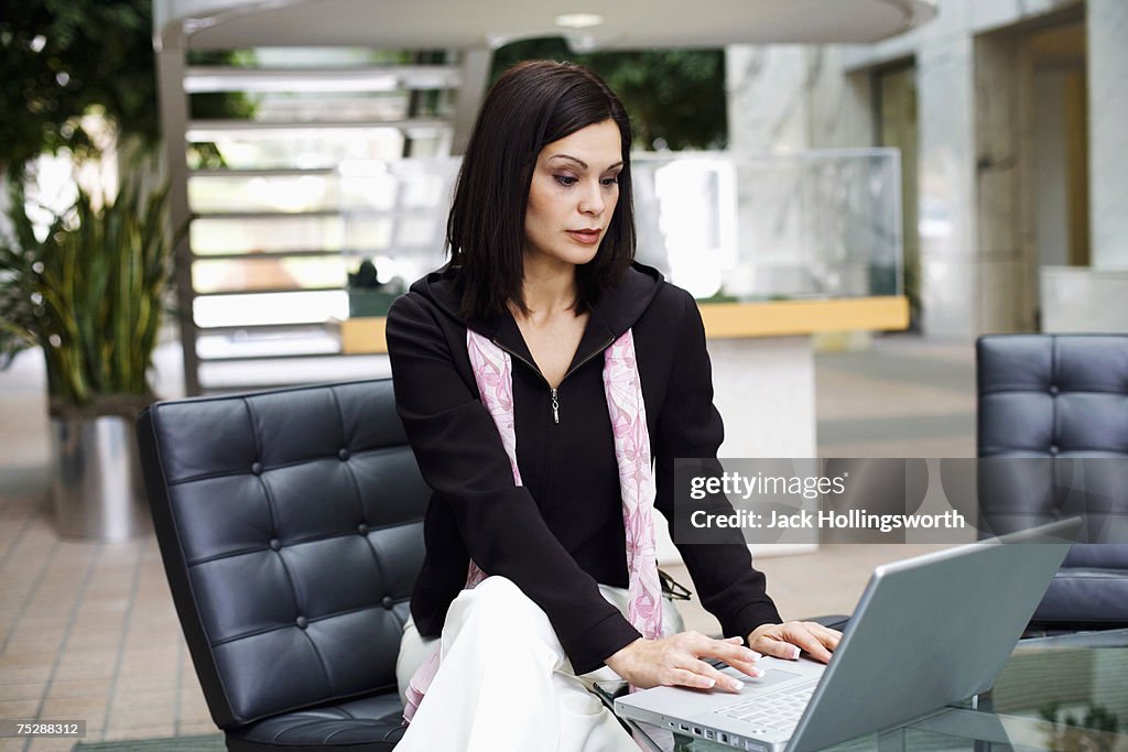 Businesswoman using laptop