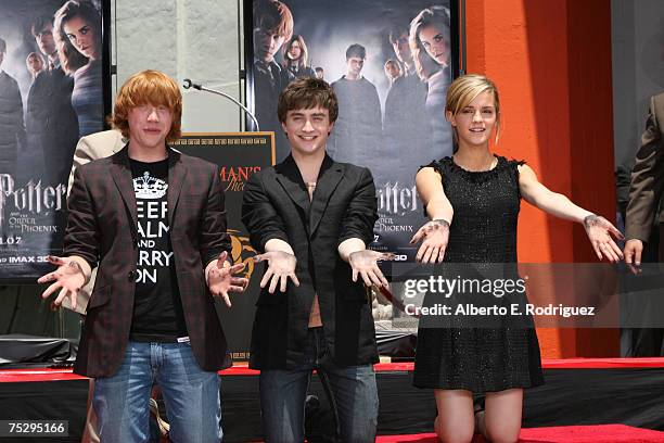 Actor Rupert Grint, actor Daniel Radcliffe and actress Emma Watson attend the Harry Potter cast "Hand, Foot and Wand-Print" ceremony held at...