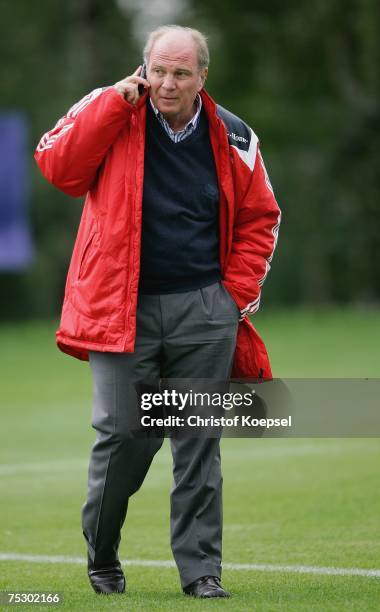 Manager Uli Hoeness call with his mobile during the training session at the training camp of Bayern Munich on July 10, 2007 in Donaueschingen,...