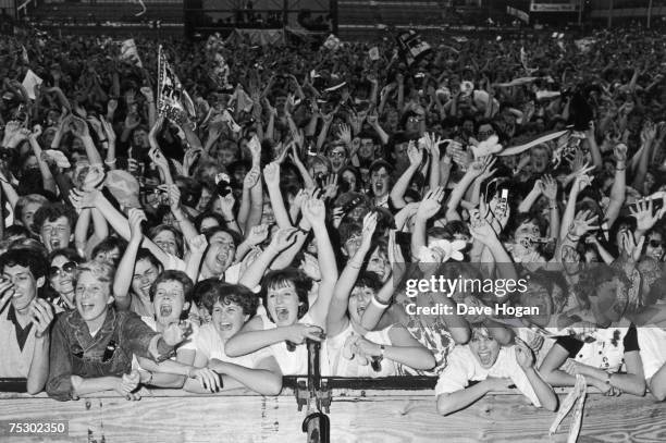 Fans of English new romantic pop group Duran Duran at one of the band's concerts, 1984.