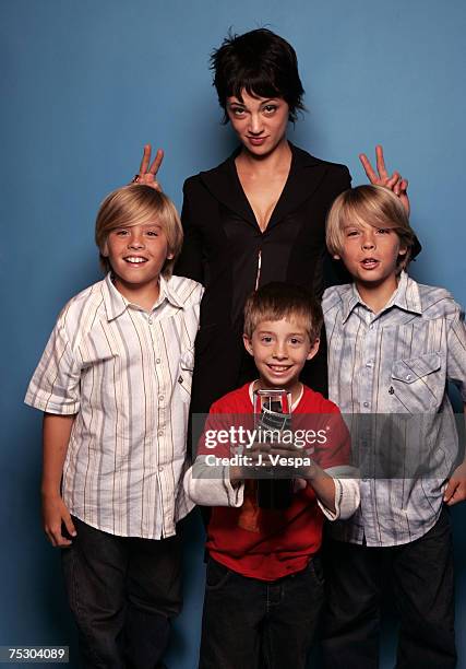 Asia Argento winner of the Hottest new Filmmaker award with presenters Jimmy Bennett and Dylan and Cole Sprouse