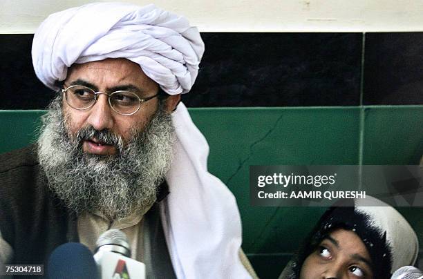 File picture taken 12 February 2007, shows Maulana Abdul Rashid Ghazi deputy chief cleric at Islamabad's Red Mosque watched by his daughter as he...