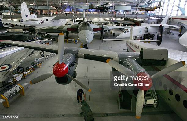 Aircrafts are displayed at a newly developed exhibition hangar at Duxford Airfield on July 10, 2007 in Duxford, England. The second phase of...