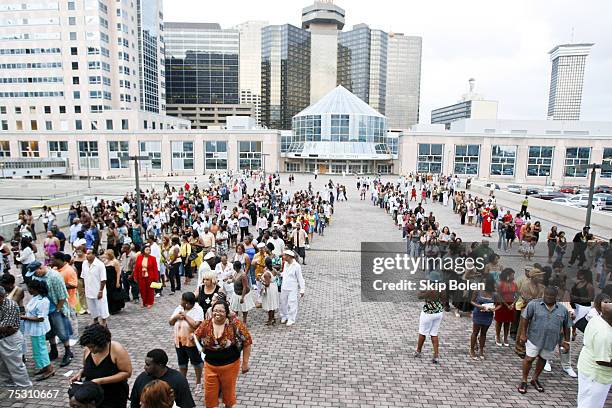 Fans and ticket holders line up outside the refurbished Louisiana Superdome for the 13th Annual 2007 Essence Music Festival. Unoccupied buildings in...