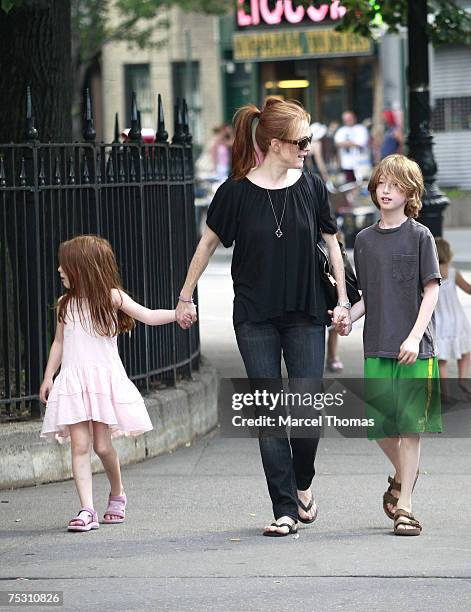 Julianne Moore sighting with her kids in the West Village, where she showed son Caleb how to use an ATM machine.