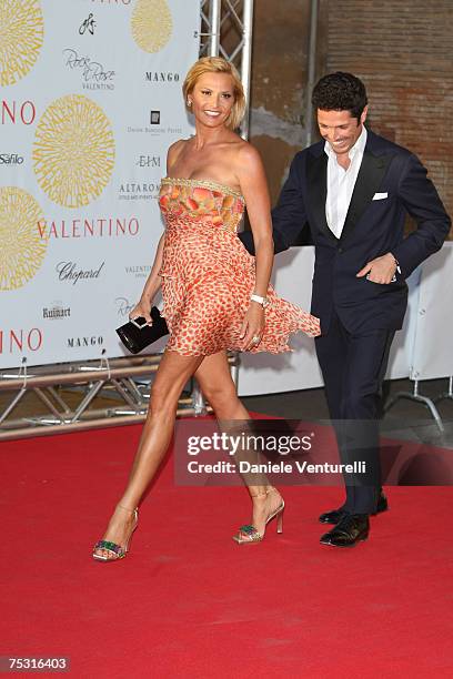 Simona Ventura and Matteo Marzotto arrive at the Ara Pacis for Valentino's Exhibition opening on July 6, 2007 in Rome, Italy.