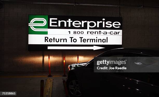 Car pulls out of the Enterprise car rental lot at the Fort Lauderdale/Hollywood International airport July 10, 2007 in Fort Lauderdale, Florida....