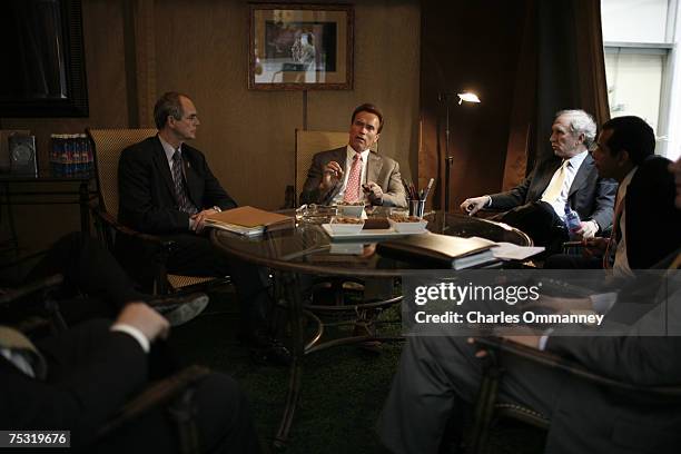 Governor Arnold Schwarzenegger, Los Angeles Mayor Villaraigosa and LA police chief William Bratton meet to smoke cigars in the "tent"at his offices...