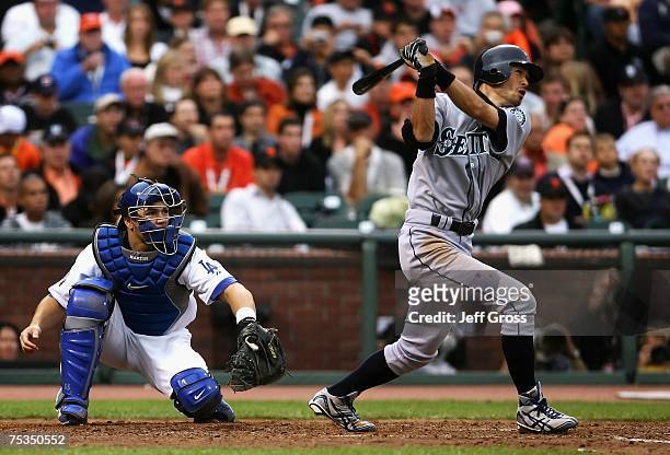 American League All-Star Ichiro Suzuki of the Seattle Mariners follows through on an inside the park home run in the fifth inning of the 78th Major...