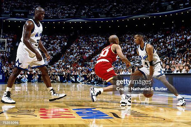 Anfernee Hardaway of the Orlando Magic drives to the basket against Kenny Smith of the Houston Rockets in Game One of the 1995 NBA Finals at the...